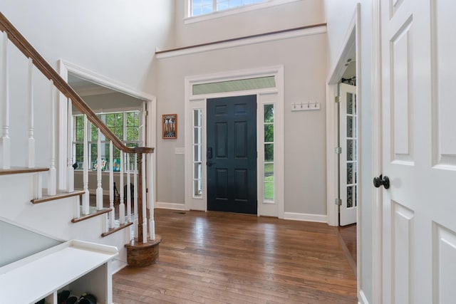 entrance foyer with dark hardwood / wood-style floors