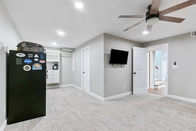 spare room with ceiling fan and carpet floors