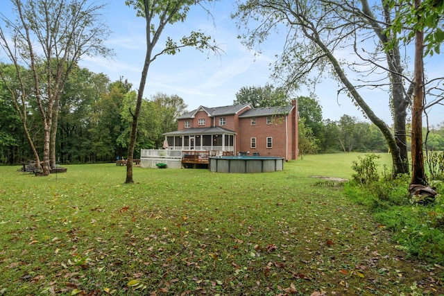 view of yard with a sunroom