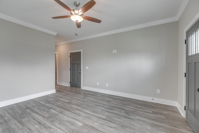 unfurnished room with crown molding, light hardwood / wood-style flooring, and ceiling fan