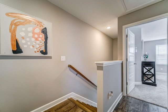 stairs with wood-type flooring