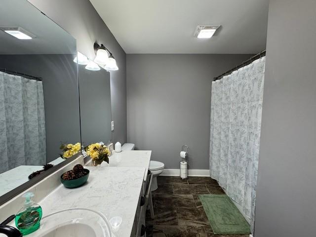 bathroom with vanity and toilet