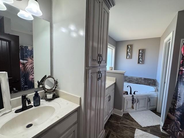 bathroom featuring a bathing tub and vanity