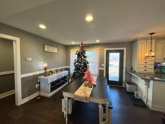 dining space with dark wood-type flooring