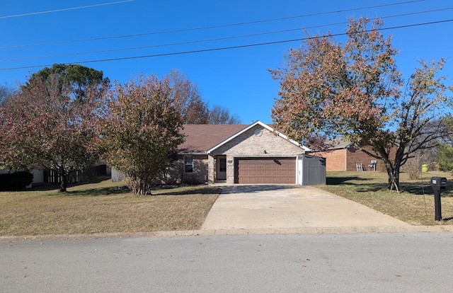 view of front of house featuring a garage and a front yard