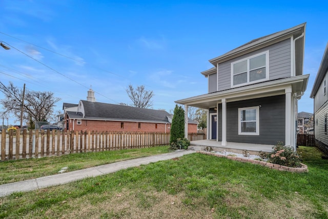 view of front of property featuring a porch and a front lawn