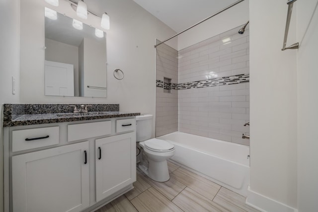 full bathroom with vanity, toilet, and tiled shower / bath