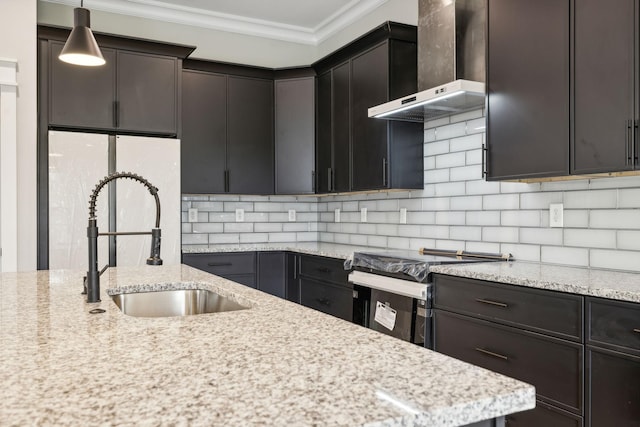 kitchen featuring hanging light fixtures, wall chimney range hood, electric range oven, light stone counters, and ornamental molding