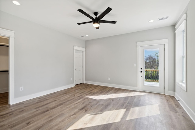 interior space with light hardwood / wood-style flooring and ceiling fan