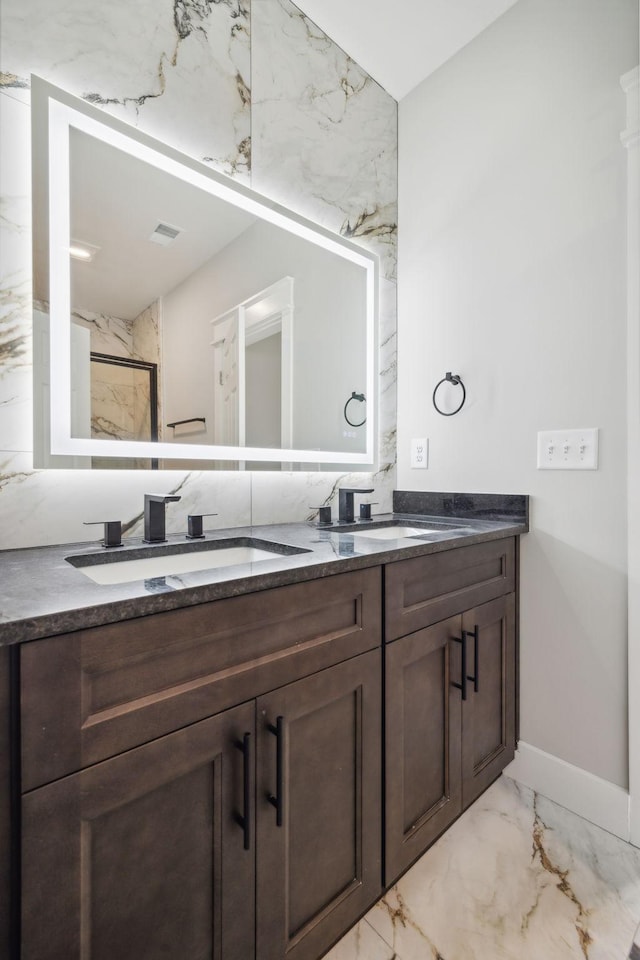 bathroom with a shower and vanity