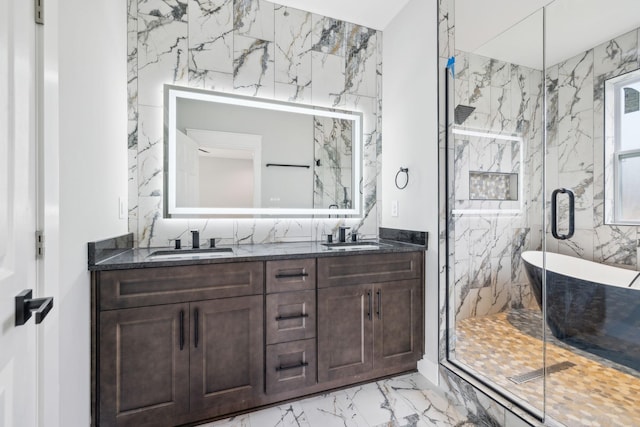 bathroom with plus walk in shower, vanity, and tile walls