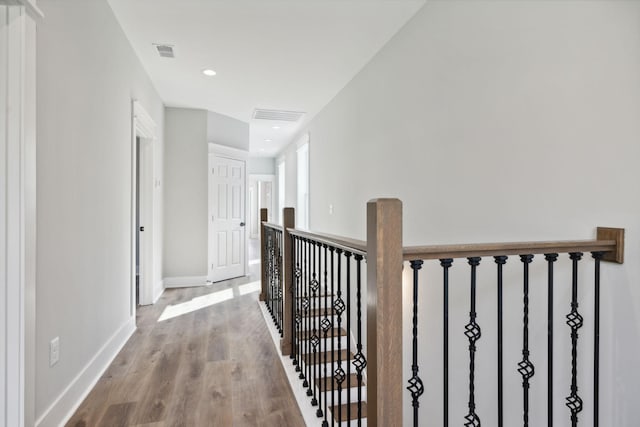 hallway with wood-type flooring