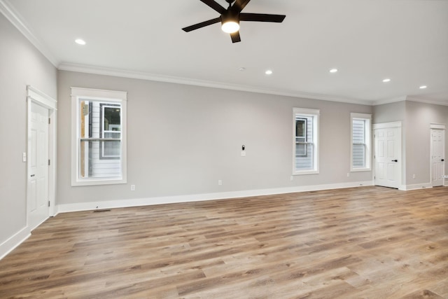 unfurnished living room featuring light hardwood / wood-style flooring, ceiling fan, and ornamental molding