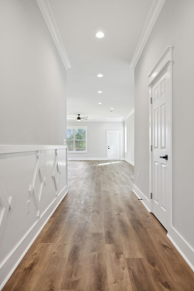 corridor featuring crown molding and wood-type flooring