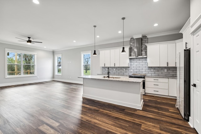 kitchen with white cabinets, dark hardwood / wood-style floors, and stainless steel range with electric stovetop