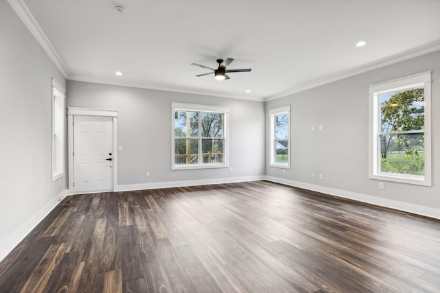 unfurnished room with crown molding, plenty of natural light, and dark wood-type flooring