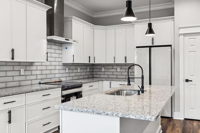 kitchen with white cabinetry, sink, wall chimney exhaust hood, dark wood-type flooring, and a center island with sink