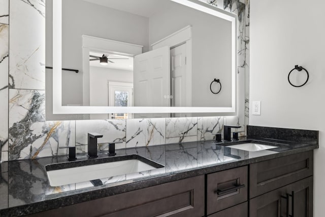 bathroom with decorative backsplash, ceiling fan, and vanity