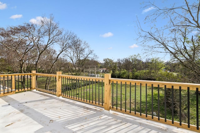 wooden terrace with a lawn