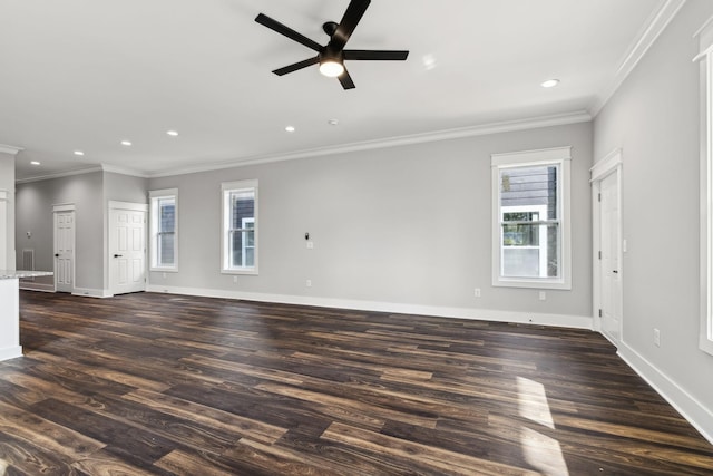 unfurnished living room featuring plenty of natural light, crown molding, and dark wood-type flooring