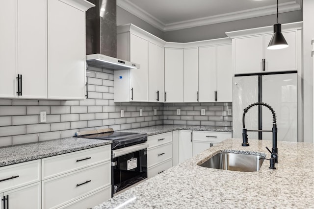 kitchen featuring sink, wall chimney range hood, electric range, white refrigerator, and white cabinetry