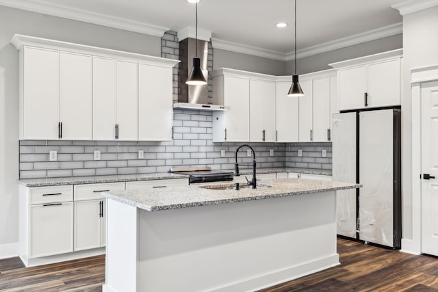 kitchen with white cabinetry, dark wood-type flooring, stainless steel appliances, and wall chimney range hood