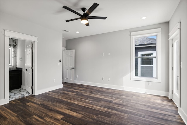 interior space with ceiling fan and dark hardwood / wood-style floors