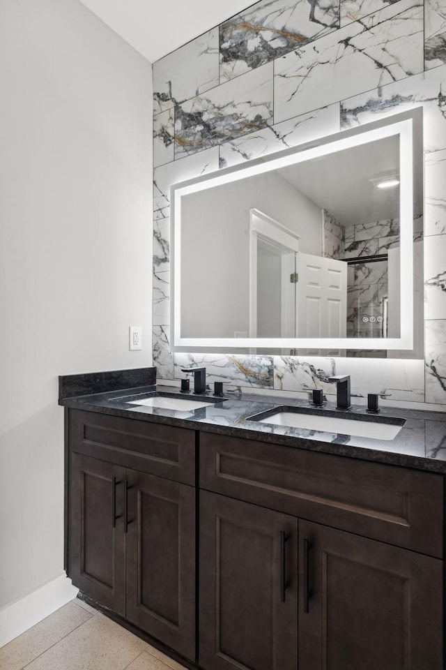 bathroom featuring vanity, walk in shower, and backsplash