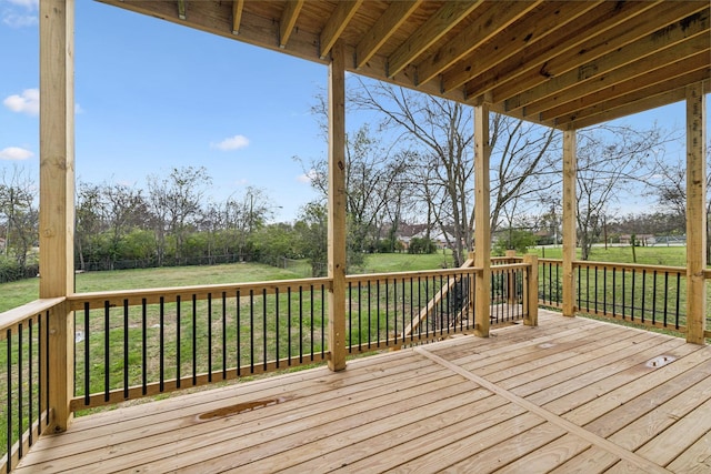 wooden terrace with a yard