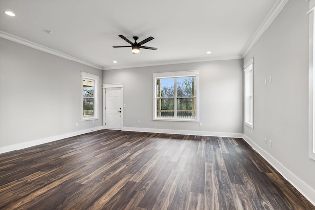 unfurnished room with dark hardwood / wood-style floors, a wealth of natural light, crown molding, and ceiling fan