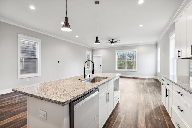 kitchen with a center island with sink, sink, stainless steel dishwasher, ceiling fan, and white cabinetry