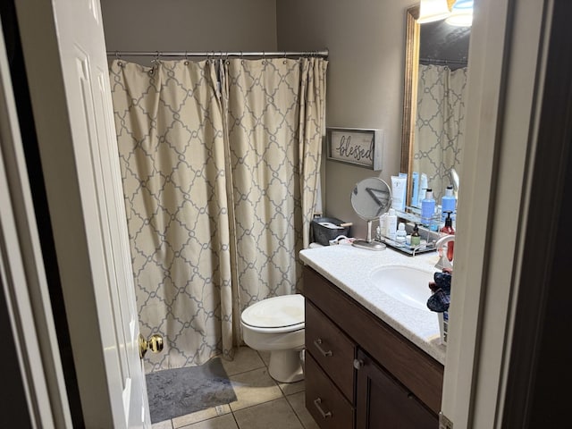 bathroom featuring tile patterned flooring, vanity, toilet, and a shower with curtain