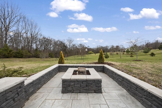 view of patio featuring a fire pit