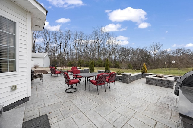 view of patio featuring an outdoor fire pit