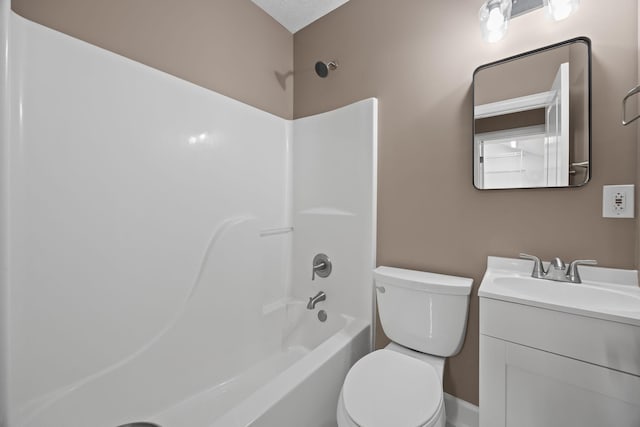 full bathroom with vanity, toilet, a textured ceiling, and bathtub / shower combination