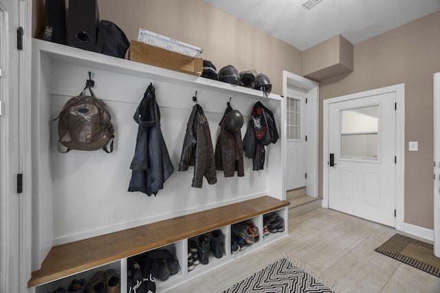 mudroom with light tile patterned flooring