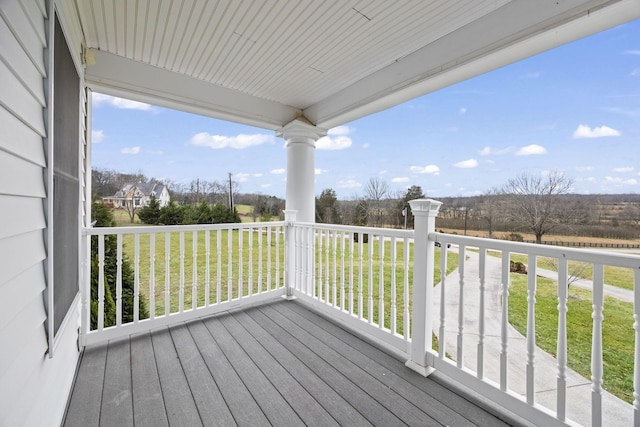 deck featuring a lawn