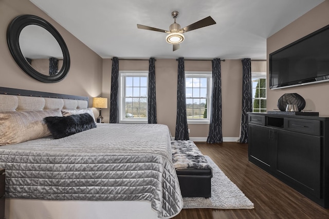 bedroom with ceiling fan and dark wood-type flooring