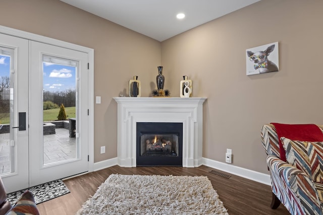 living room featuring dark hardwood / wood-style floors