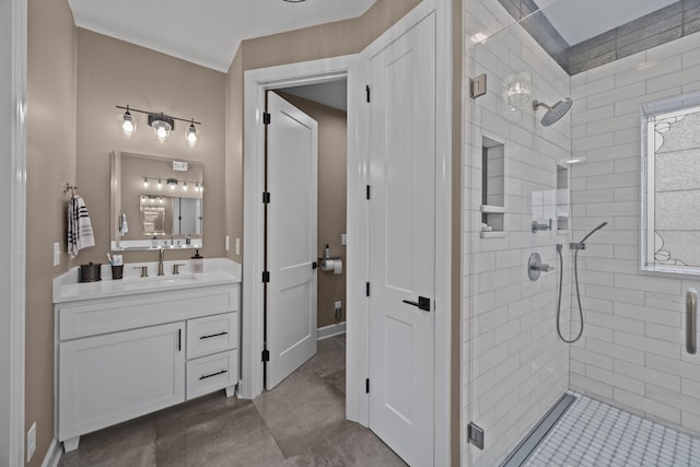 bathroom featuring vanity and a shower with shower door