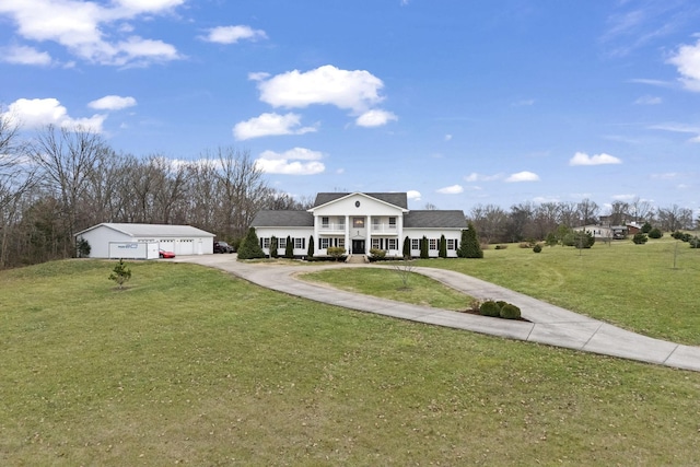 greek revival inspired property with a front lawn, covered porch, and a garage