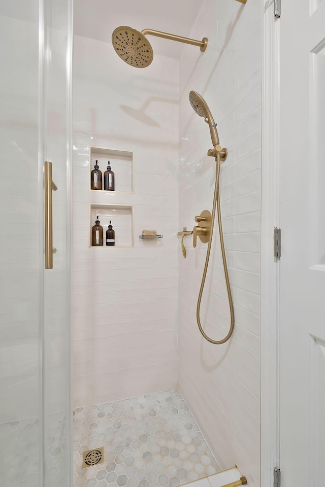 bathroom with tiled shower