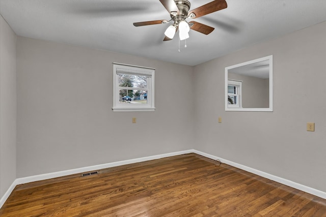 empty room featuring hardwood / wood-style floors and ceiling fan