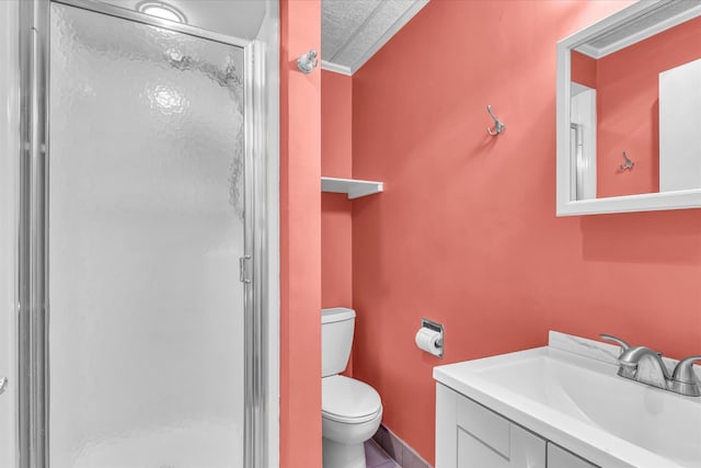 bathroom featuring a textured ceiling, vanity, toilet, and a shower with door