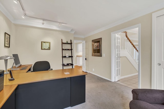 home office with carpet flooring, track lighting, and ornamental molding