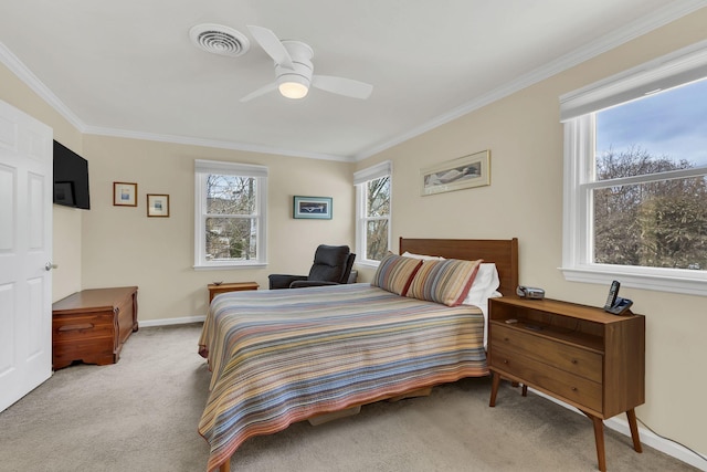 bedroom featuring light carpet, ceiling fan, and crown molding