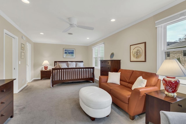 bedroom with multiple windows, ceiling fan, light colored carpet, and ornamental molding