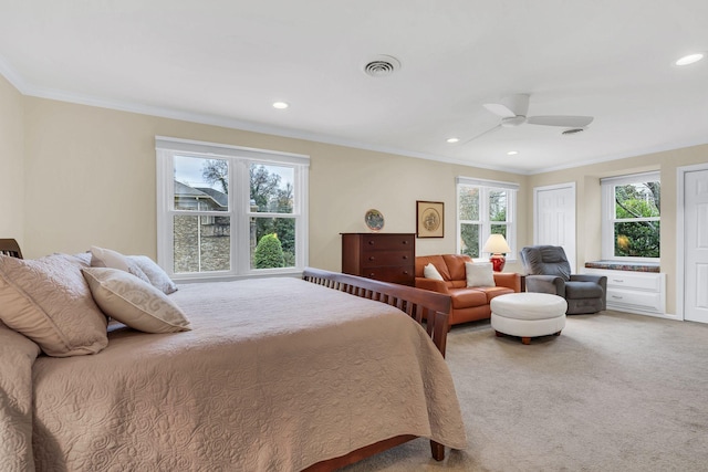 bedroom with multiple windows, ceiling fan, carpet floors, and ornamental molding