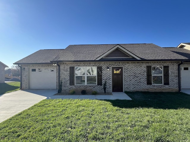 view of front facade with a front lawn and a garage