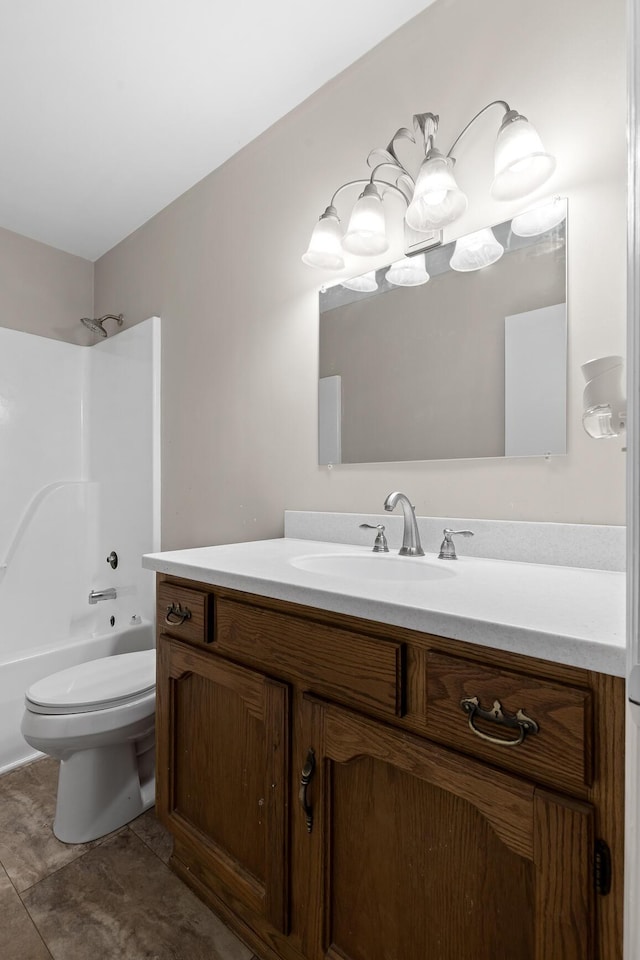 full bathroom featuring tile patterned flooring, vanity, toilet, and washtub / shower combination